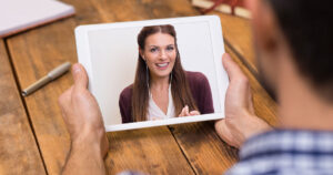 man talking to a woman over video
