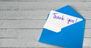 thank you note peaking from an envelope