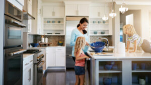 Mother and kids in the kitchen baking