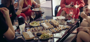 group of women having cheese and wine