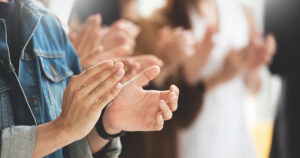 close up of hands clapping