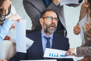 business man bombarded from all sides