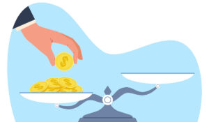 hand puts coins on scales and puts them out of balance